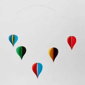 Colorful hot air balloon mobile against a light gray background