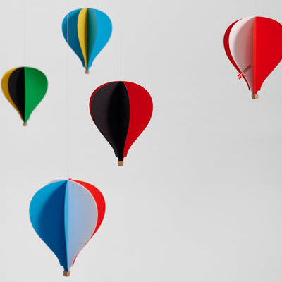 Colorful hot air balloon mobile on a white background