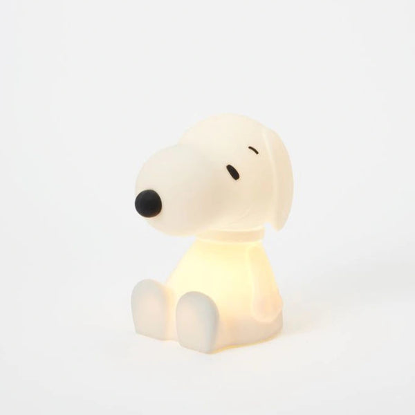Dog-shaped night light on a white background