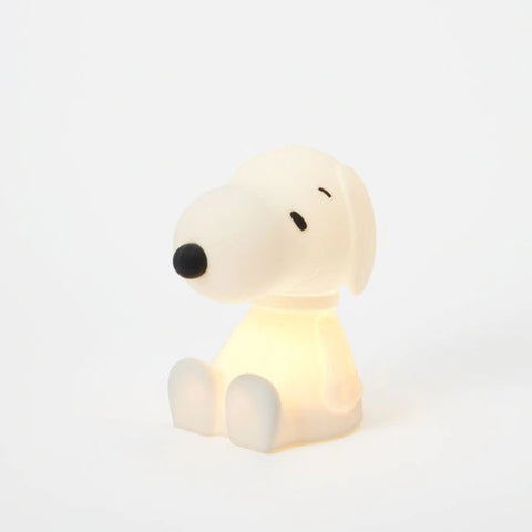 Dog-shaped night light on a white background